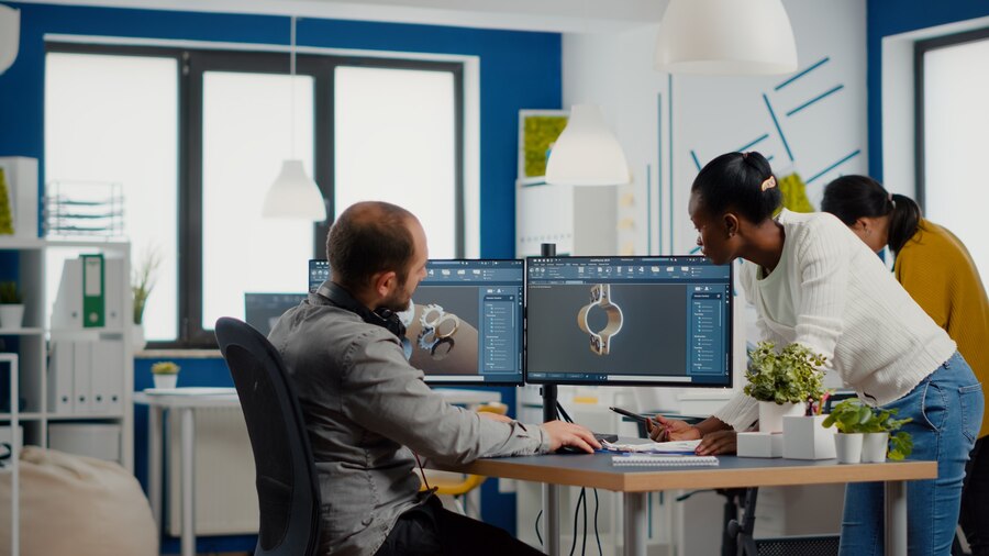 professional-heavy-industry-team-engineers-working-computer-with-two-monitors-using-cad-softwa_482257-3422 https://www.goldenshield.sa/wp-content/uploads/2024/05/professional-heavy-industry-team-engineers-working-computer-with-two-monitors-using-cad-softwa_482257-3422.jpg